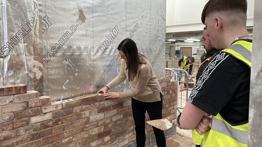 Maya Ellis MP lays a brick at Preston College